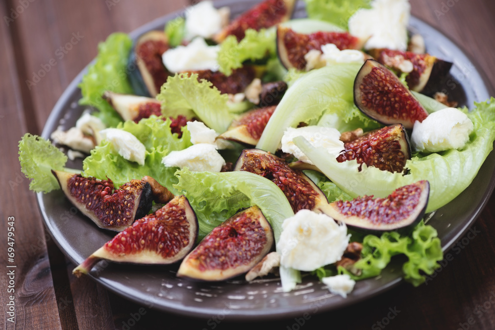 Fig fruits, cheese and walnuts salad, close-up, horizontal shot Fig fruits, cheese and walnuts salad, close-up, horizontal shot
