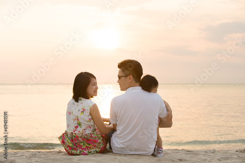 Asian family at outdoor beach