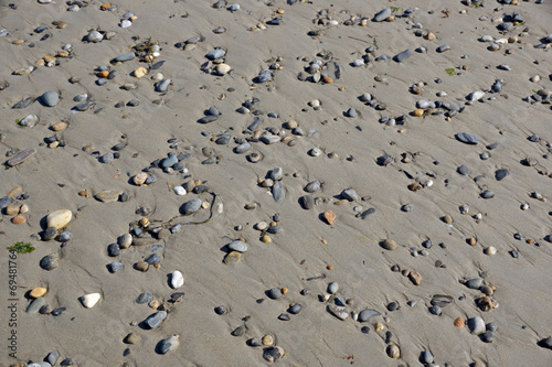 Pebble rocks in the sand