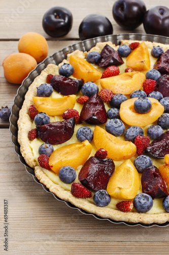 Sweet tart with peaches, plums and blueberries
