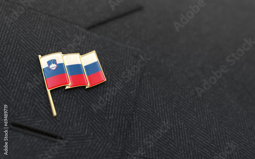 Slovenia flag lapel pin on the collar of a business suit