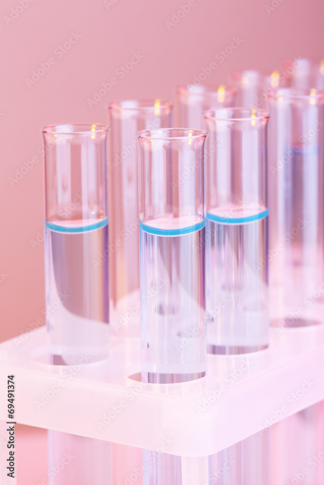 Test tubes with liquid on light background Test tubes with liquid on light background