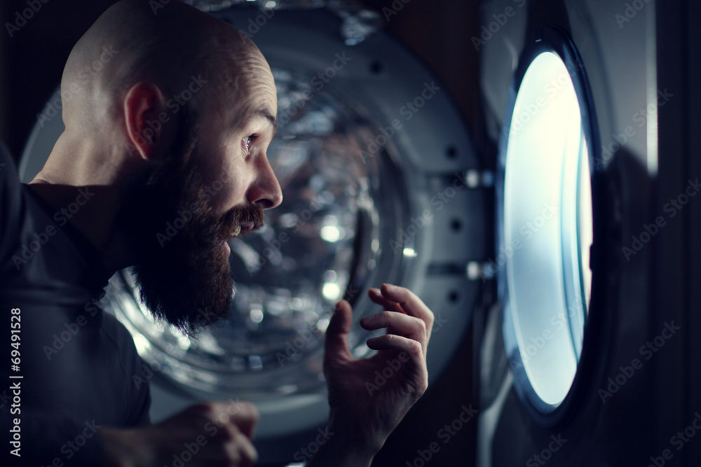 Fototapeta premium man next to a washing machine