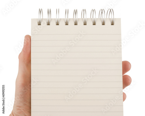 Hand holding an empty notepad (notebook) isolated on white