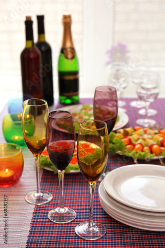 Buffet table with dishware waiting for guests