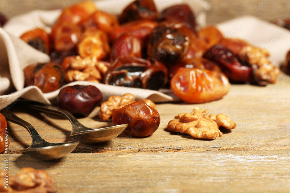 Tasty dates fruits on wooden table Tasty dates fruits on wooden table