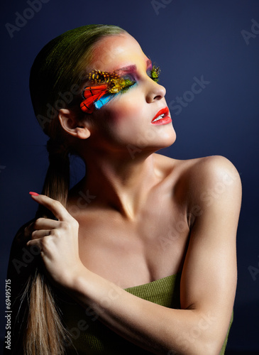 Woman with fashion feather eyelashes make-up