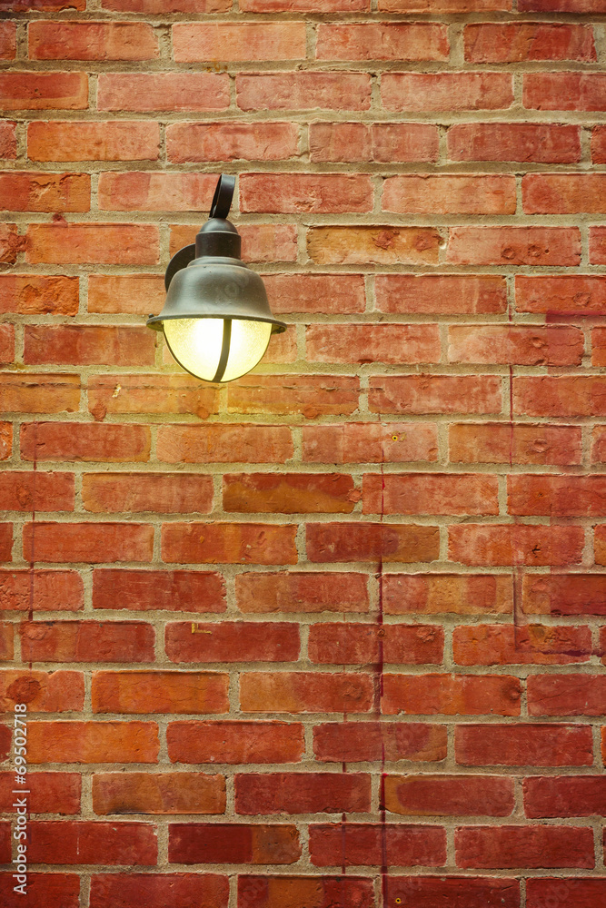 Street lamp on red brick wall Street lamp on red brick wall