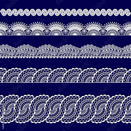 set of white lace ribbons on a blue background