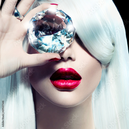 Portrait of beauty model girl with a big diamond