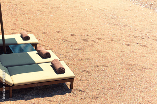 Canvas chairs on the beach photo