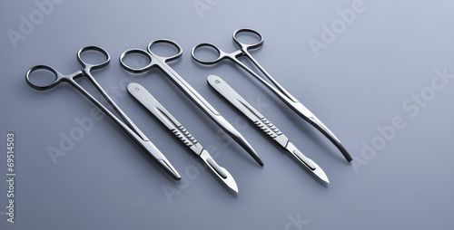 Photos Surgical instruments on a blue-gray background