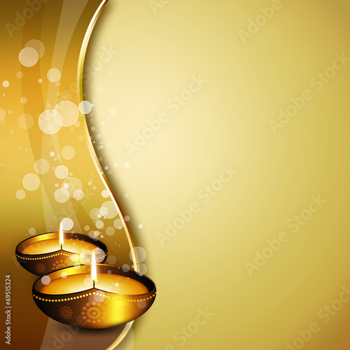 oil lamps with diwali greetings over gold background photo