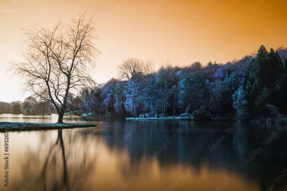 False color lake landscape with calm relfection