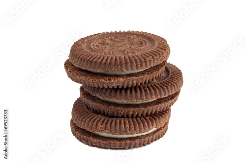 Closeup of a stack of chocolate cookies with white filling
