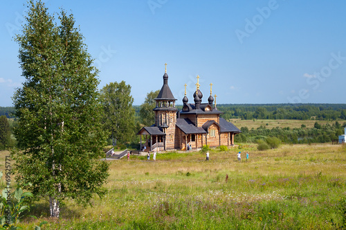 Wooden church of All Saints of Siberia on the Tura river. photo