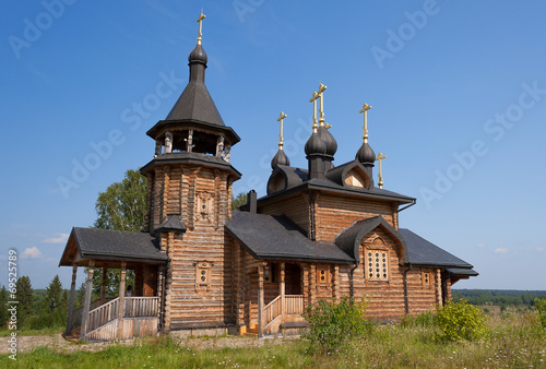 Wooden church of All Saints of Siberia on the Tura river. photo