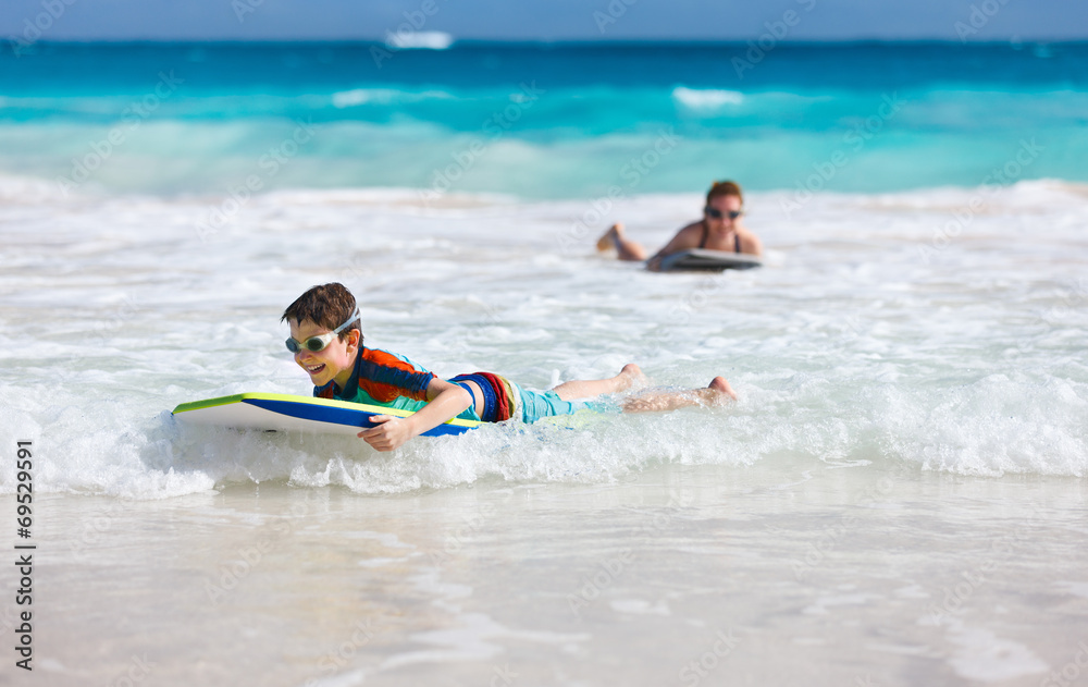 Mother and son surfing