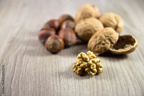Mix of nuts on a wooden background