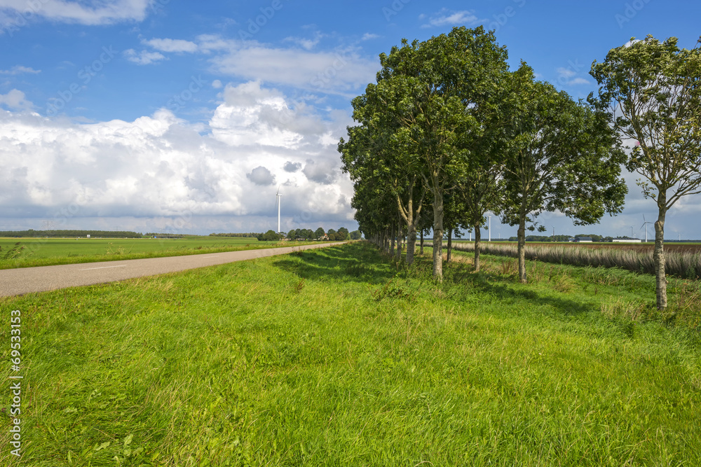 Clouds over a road through the countryside