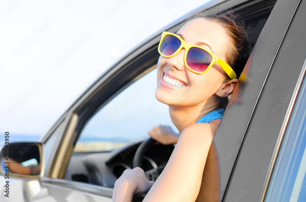 Woman car driver happy