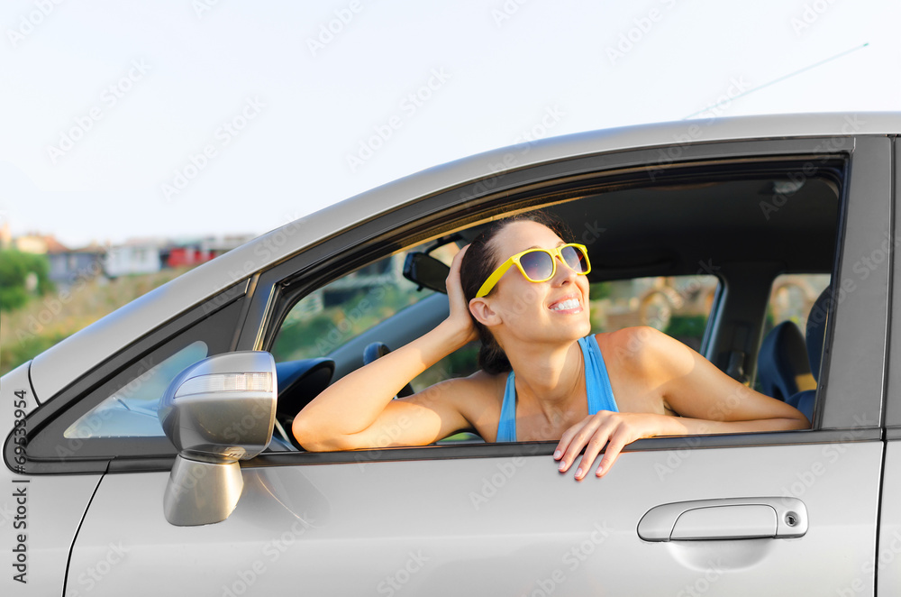 Naklejka premium Car woman driver happy