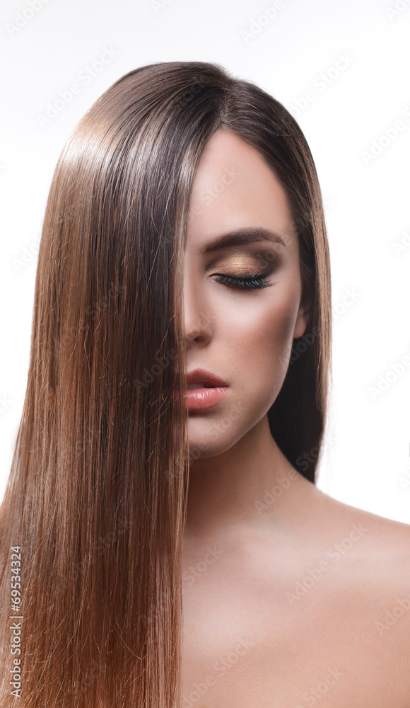 Naklejka premium Beautiful young woman with long hair isolated on white