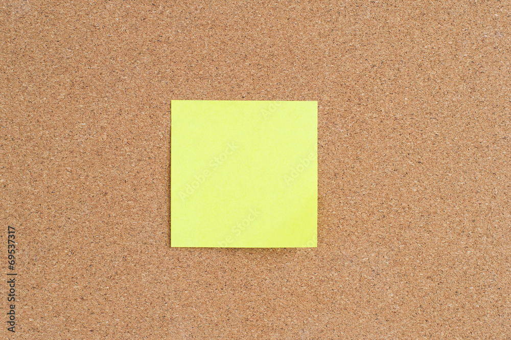 Sticky note on cork board Sticky note on cork board