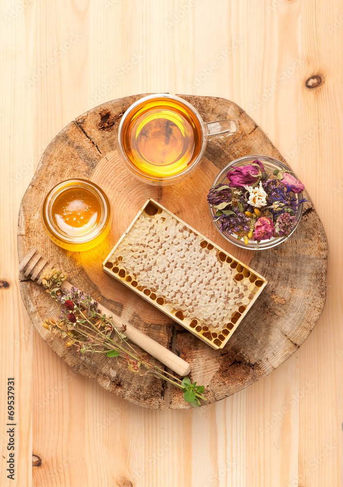 Fototapeta premium Honey, dried herbs and herbal tea