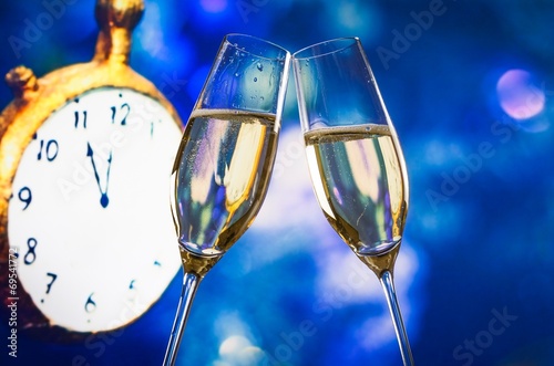 New Year or Christmas at midnight with champagne flutes