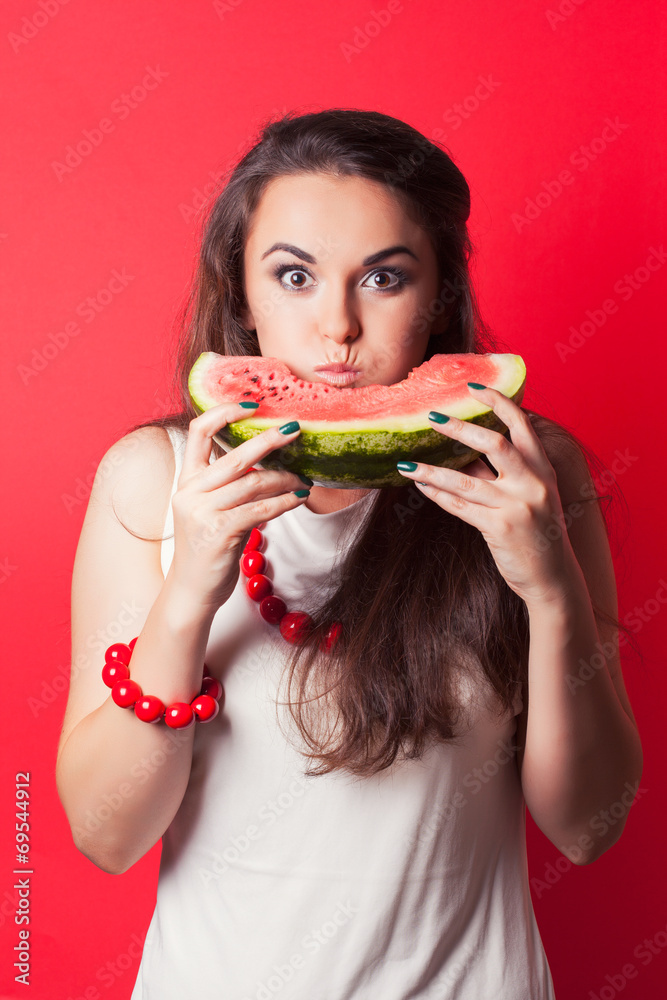 beautiful young woman holding watermelon against red background beautiful young woman holding watermelon against red background
