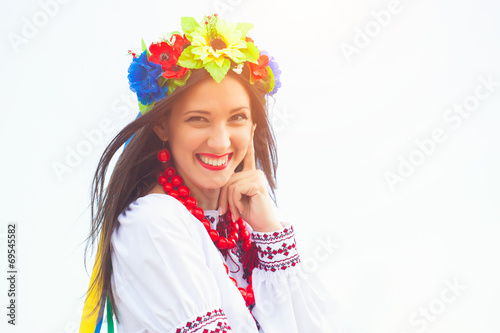 beautiful young woman wearing national ukrainian clothes posing