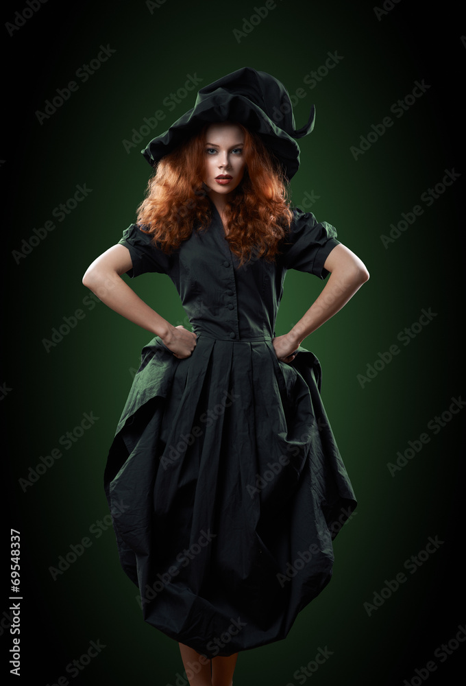 beautiful red-haired girl in costumes witch beautiful red-haired girl in costumes witch