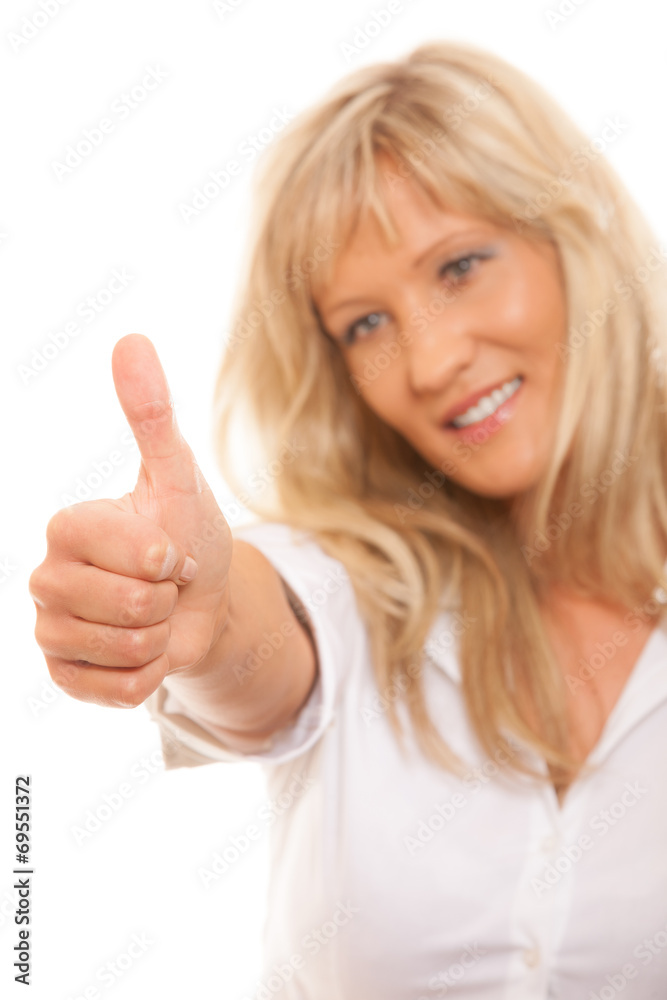 Mature woman giving thumbs up sign isolated Mature woman giving thumbs up sign isolated
