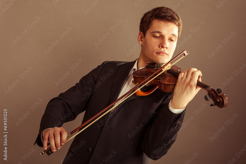 Man violinist playing violin. Classical music art Man violinist playing violin. Classical music art