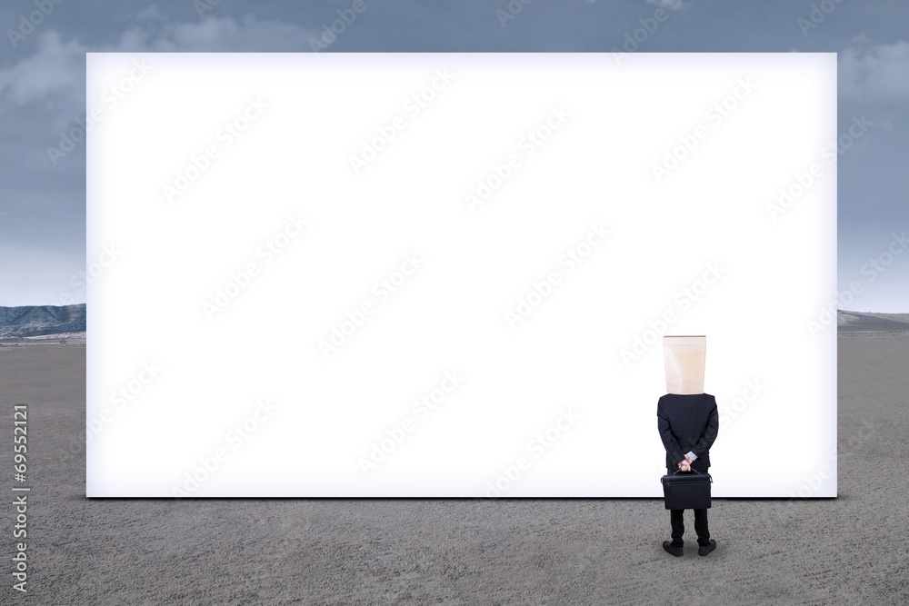 Anonymous businessman and empty billboard 1 Anonymous businessman and empty billboard 1