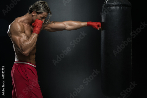 Attractive Man With Boxing Bag