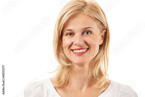 Happy young woman smiling over white