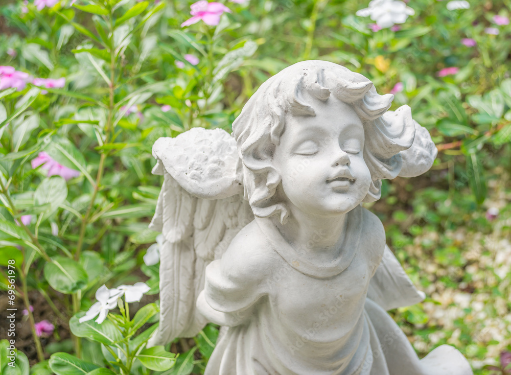 Fairy Statue in the garden with flower