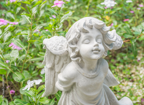 Fairy Statue in the garden with flower © coffmancmu