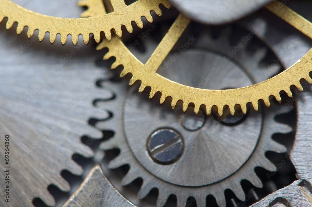 Background with metal cogwheels a clockwork. Macro Background with metal cogwheels a clockwork. Macro