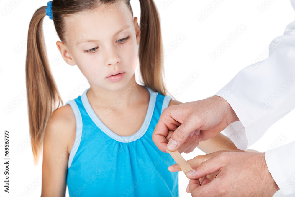 doctor putting plaster on finger isolated on white background. doctor putting plaster on finger isolated on white background.