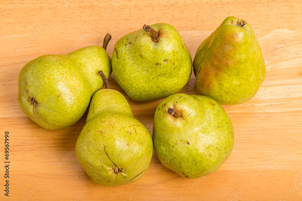 Green Bartlett Pears on Wood Table Green Bartlett Pears on Wood Table