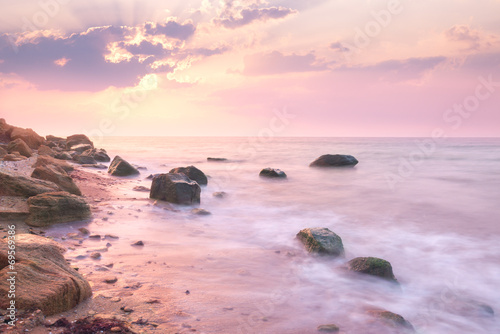 Sunrise landscape over beautiful rocky coastline in the Sea