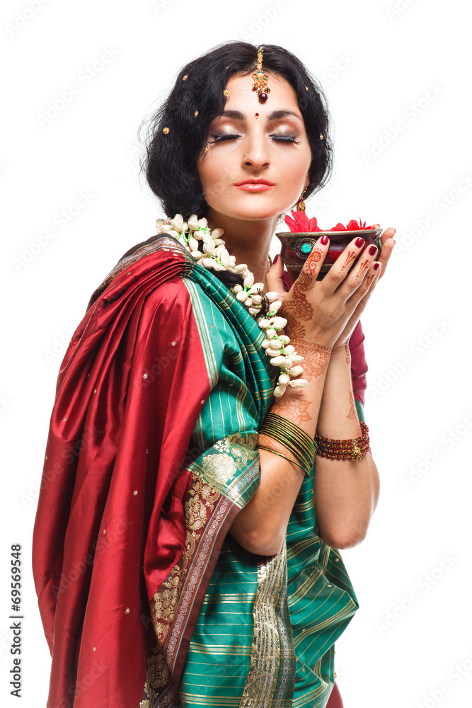 Beautiful young indian woman in traditional clothing, isolated
