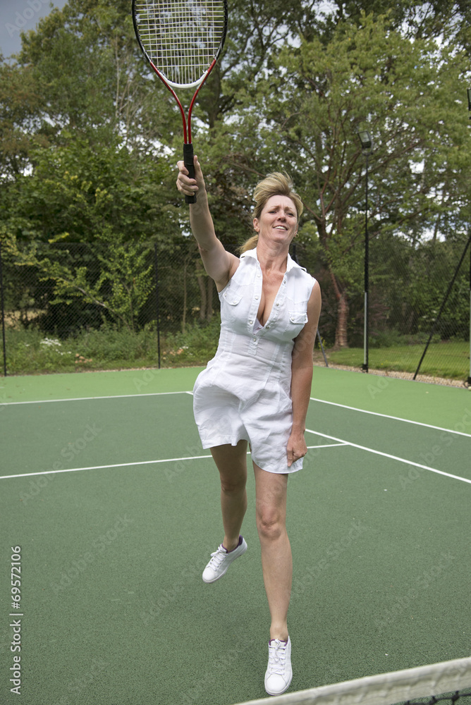 Female tennis player in action on a court
