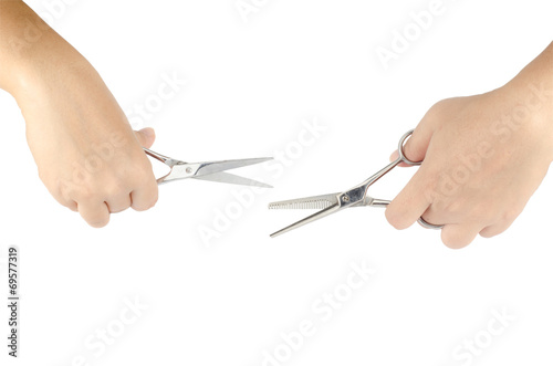 Hair's scissors in hands