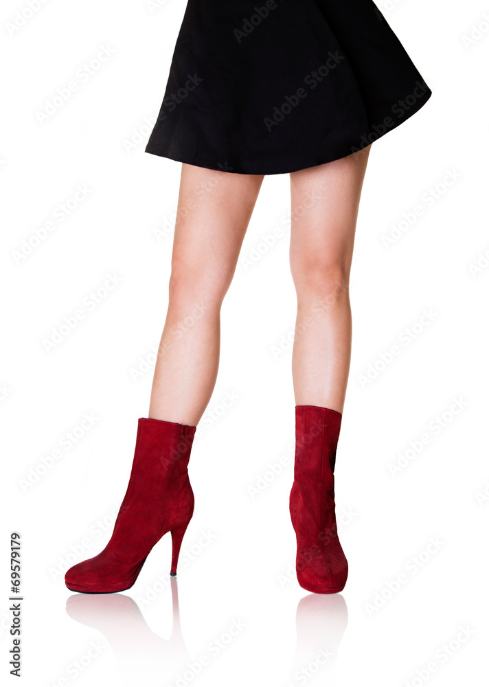 Beautiful woman legs with shoes.Fashion styles.Red boots. Beautiful woman legs with shoes.Fashion styles.Red boots.