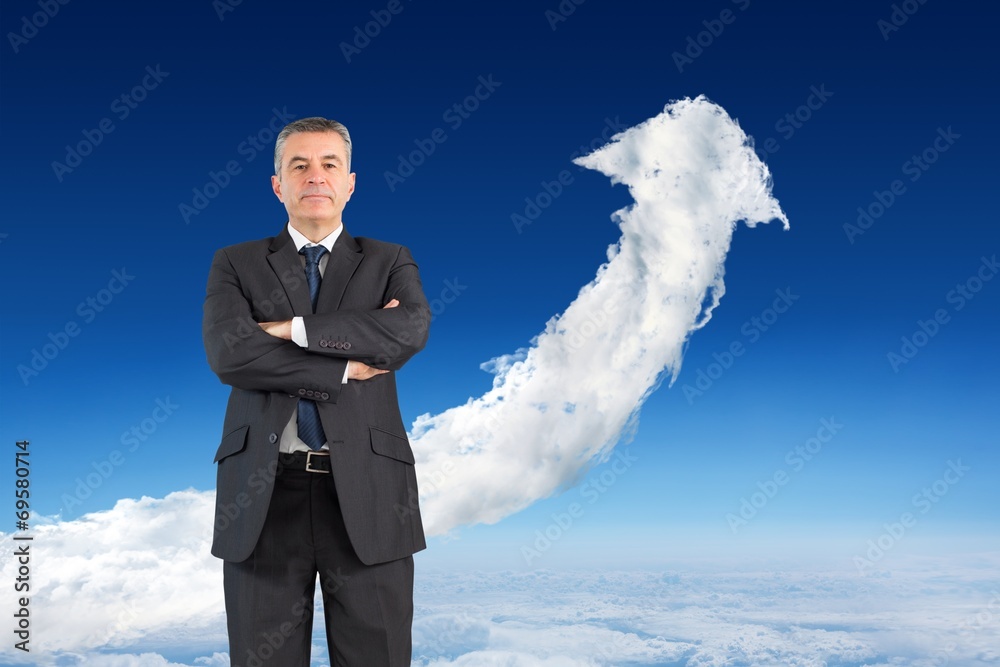 Composite image of mature businessman looking at camera Composite image of mature businessman looking at camera