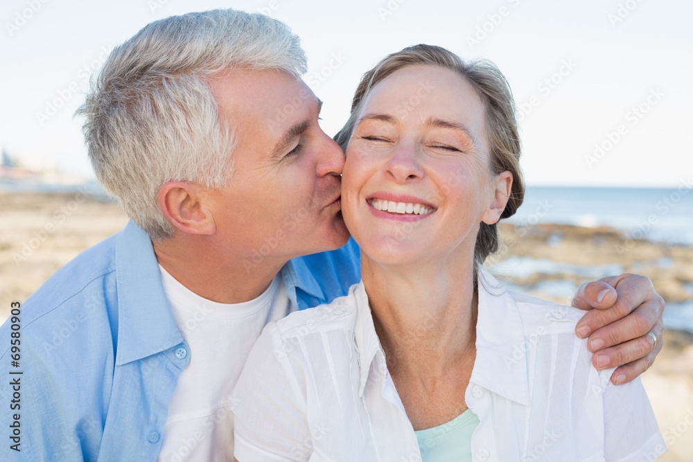 Fototapeta premium Casual couple having fun by the sea